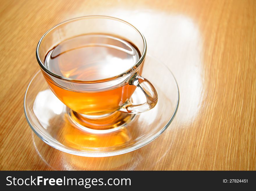 Glass Cup of Green Tea on the Wooden Table
