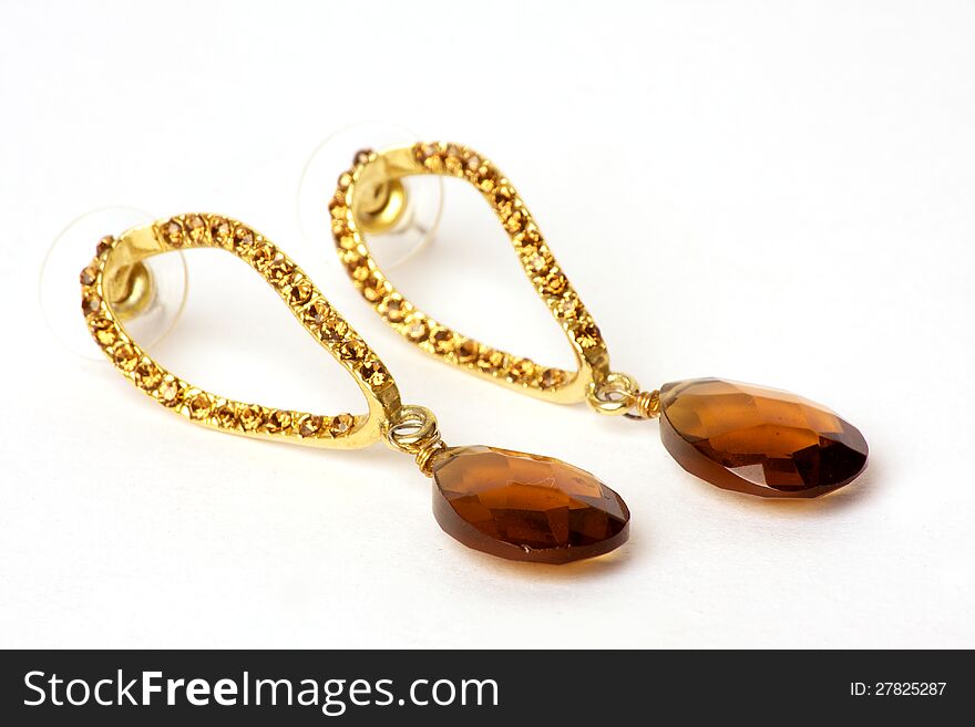 Pair of classy gold earrings with a big stone. Pair of classy gold earrings with a big stone.