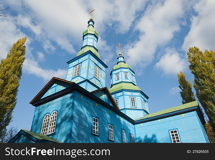 Old wooden Ukrainian church on a background of blue sky. Old wooden Ukrainian church on a background of blue sky