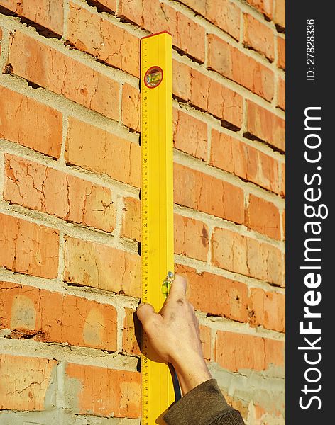 Measure the level of the wall construction. Measure the level of the wall construction