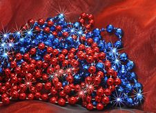 Blue And Red Christmas Decorative Beads On Silk Christmas Stock Photography