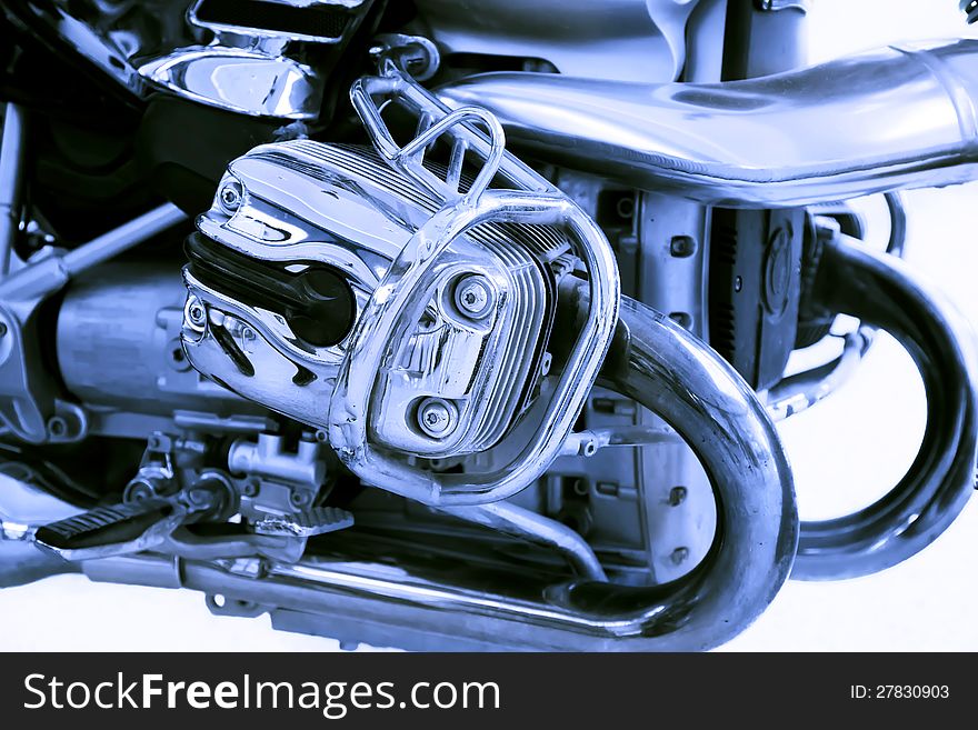 Motorcycle engine close-up on white background