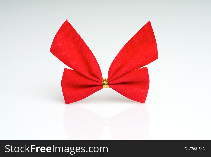 A red ribbon bow on white background
