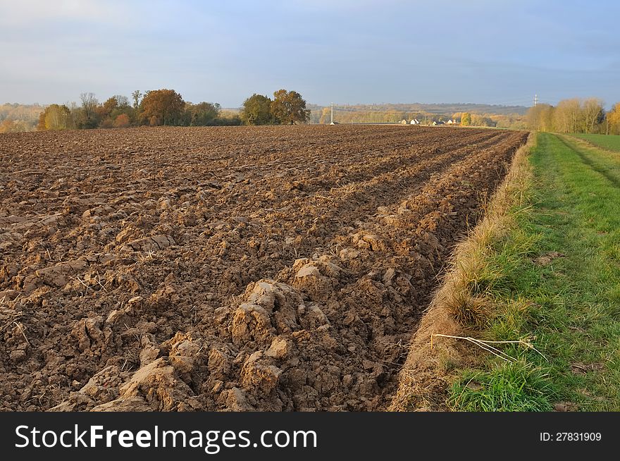 Field of freshly turned topsoil forming large clods of earth. Field of freshly turned topsoil forming large clods of earth