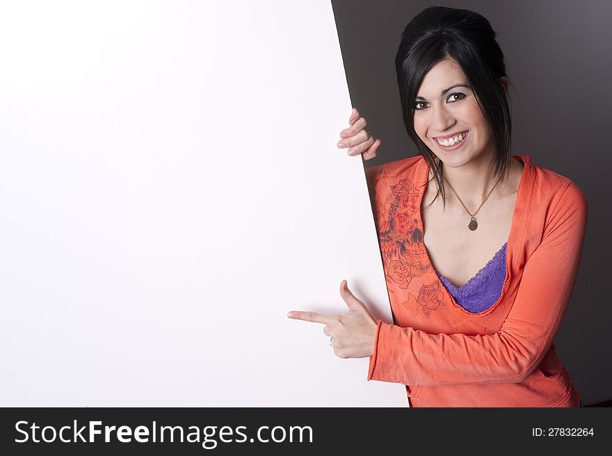 Sales Woman Points To Blank Area White Board