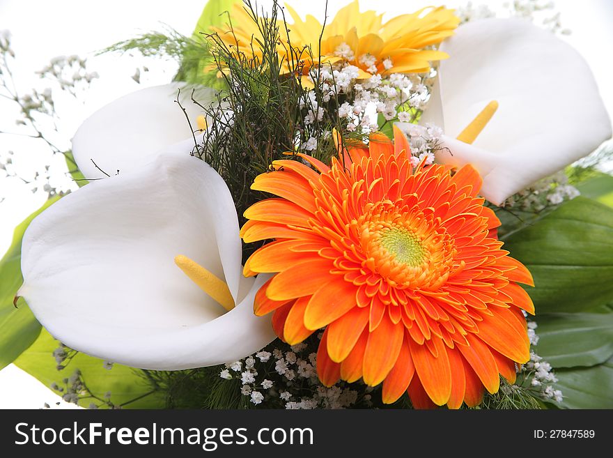 Bright bouquet shot from above, close-up. Calla and Gerbera flowers