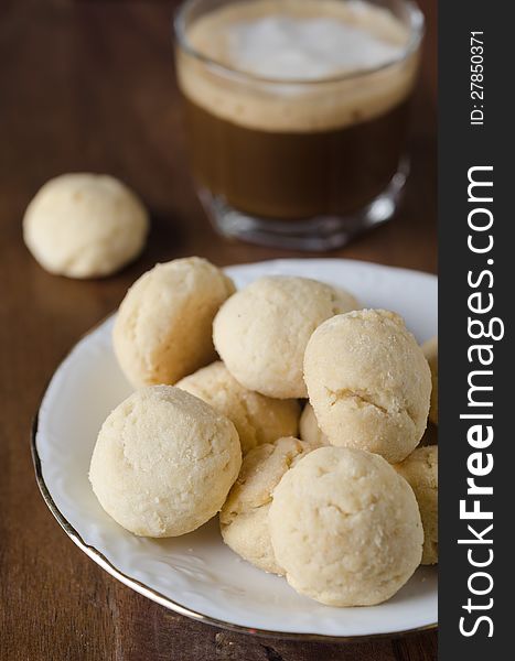 Mini shortbread biscuits and coffee closeup