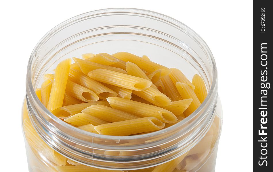 Pasta in the glass jar on white background. Pasta in the glass jar on white background