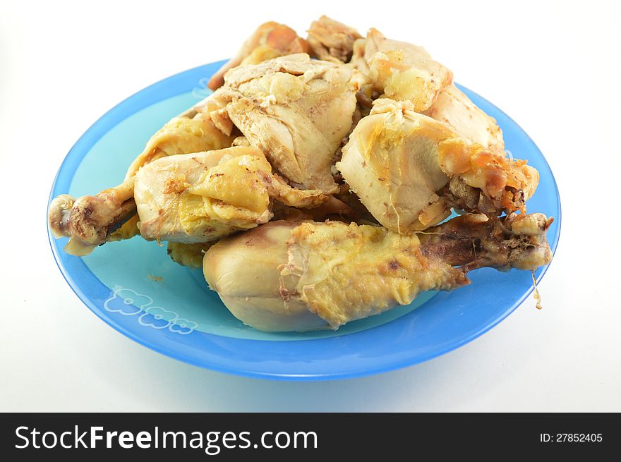 Cooked chicken meat in a plate.