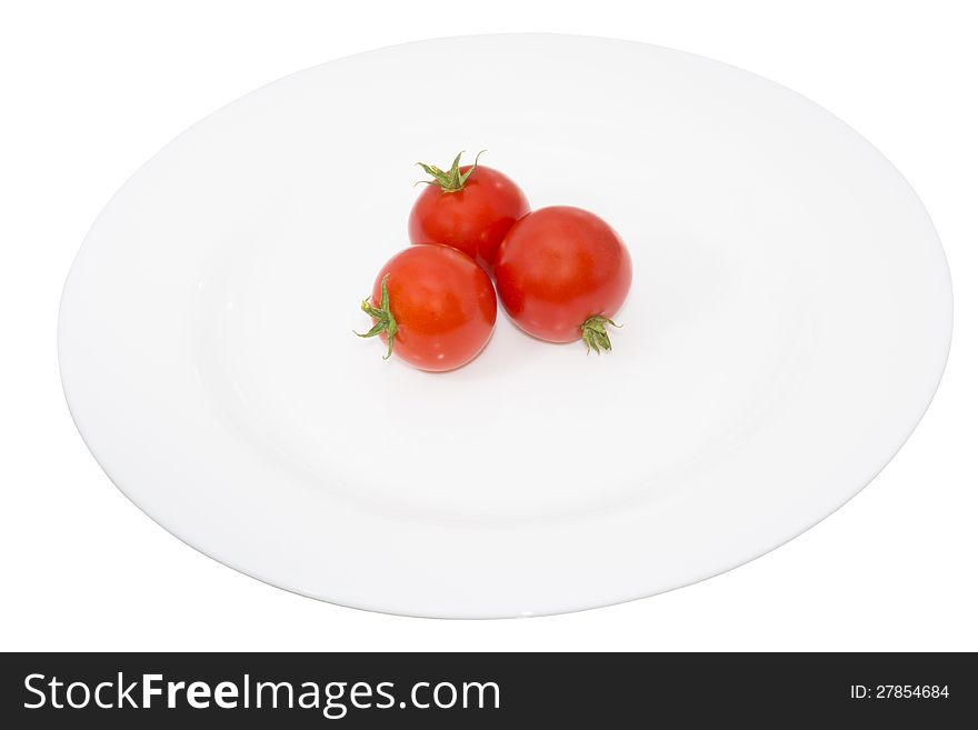 Tomato in a plate, isolated and closeup