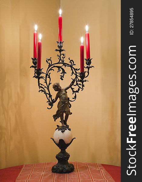 Romantic metallic candlestick on the table. Romantic metallic candlestick on the table