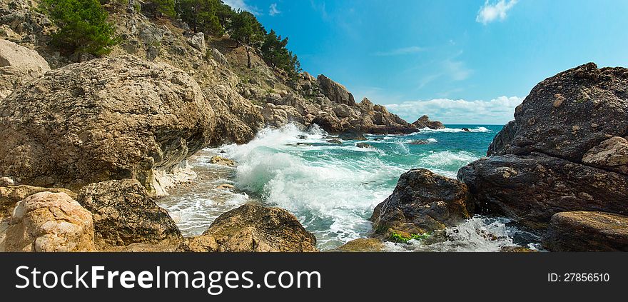 Sea waves breaking on the rocky coast of the Crimean coast. Sea waves breaking on the rocky coast of the Crimean coast