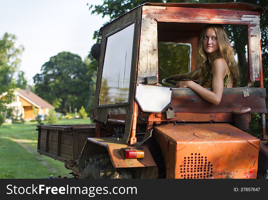 Farmer Girl Driving A Tractor