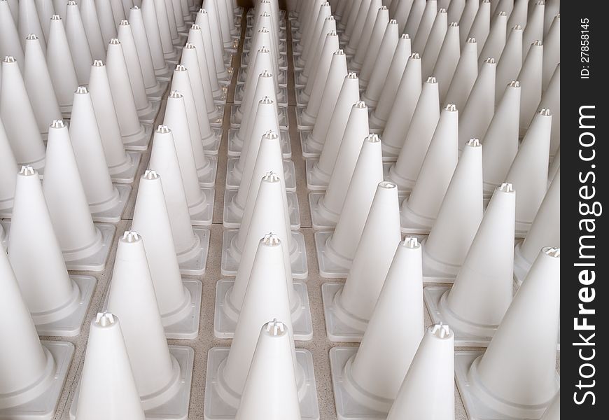 White cone warning signs standing in a row. White cone warning signs standing in a row