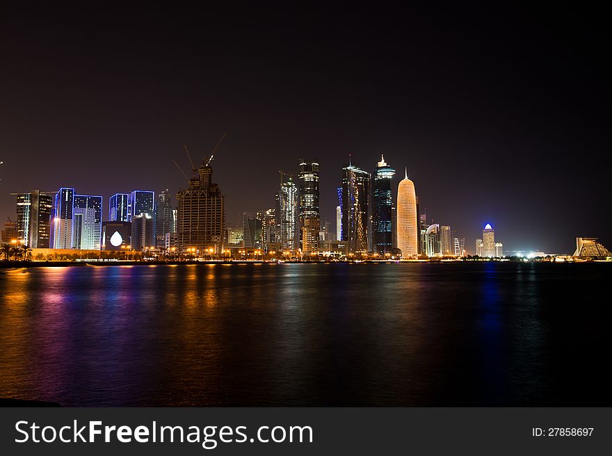 Slow shutter night time shot of the Doha West Bay area across the corniche. Slow shutter night time shot of the Doha West Bay area across the corniche.