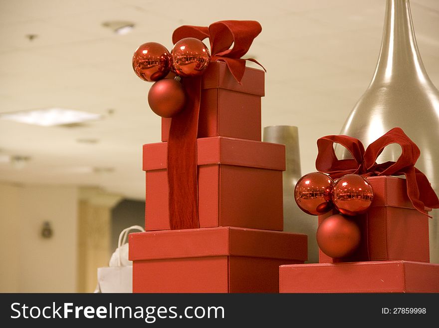 Beautiful red Christmas boxes with a vase background. Beautiful red Christmas boxes with a vase background