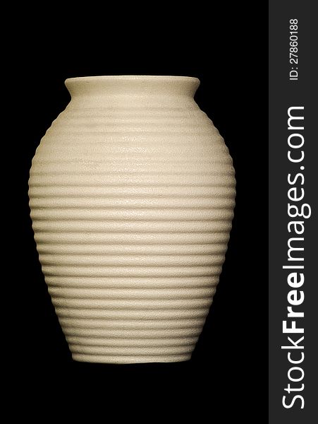 Ceramic jar on black background