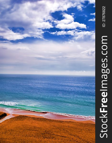 Beach and a blue sky as background. Beach and a blue sky as background