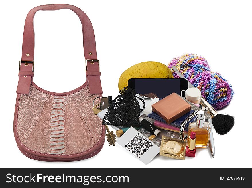 Contents of ladies' handbag isolated over white background. Contents of ladies' handbag isolated over white background