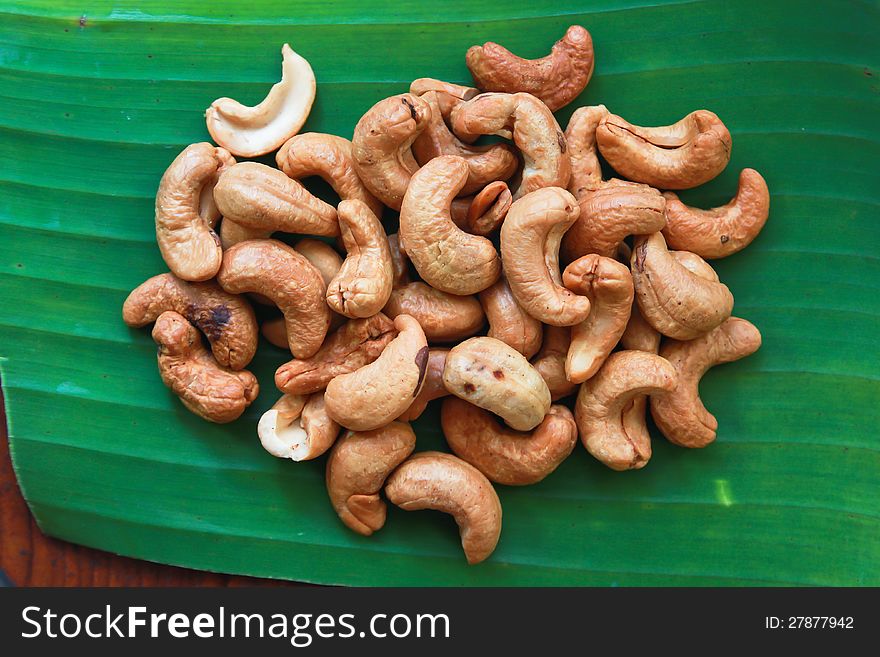 Cashew nuts on green banana leaf. Cashew nuts on green banana leaf