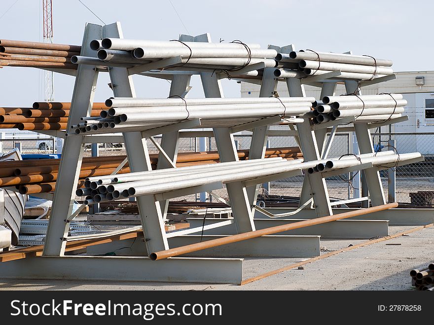 Metal pipe stack on warehouse (racks with pipes)