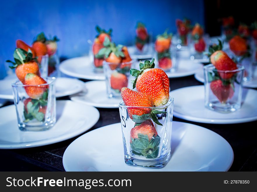 Food preparations with strawberry on glass