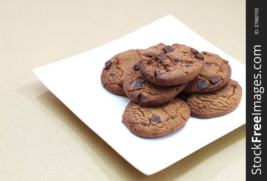 Chocolate cookie on brown background