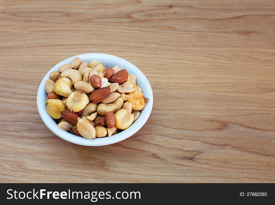 Mixed Nuts on wood background