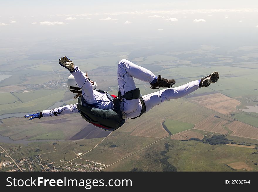 A girl performs in a free fall free style. A girl performs in a free fall free style.