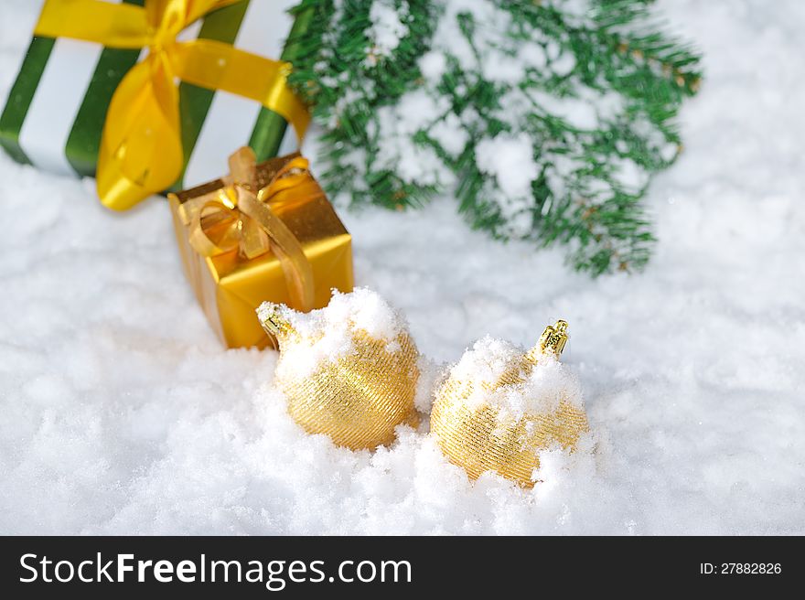 Golden Christmas decoration on snow. Golden Christmas decoration on snow