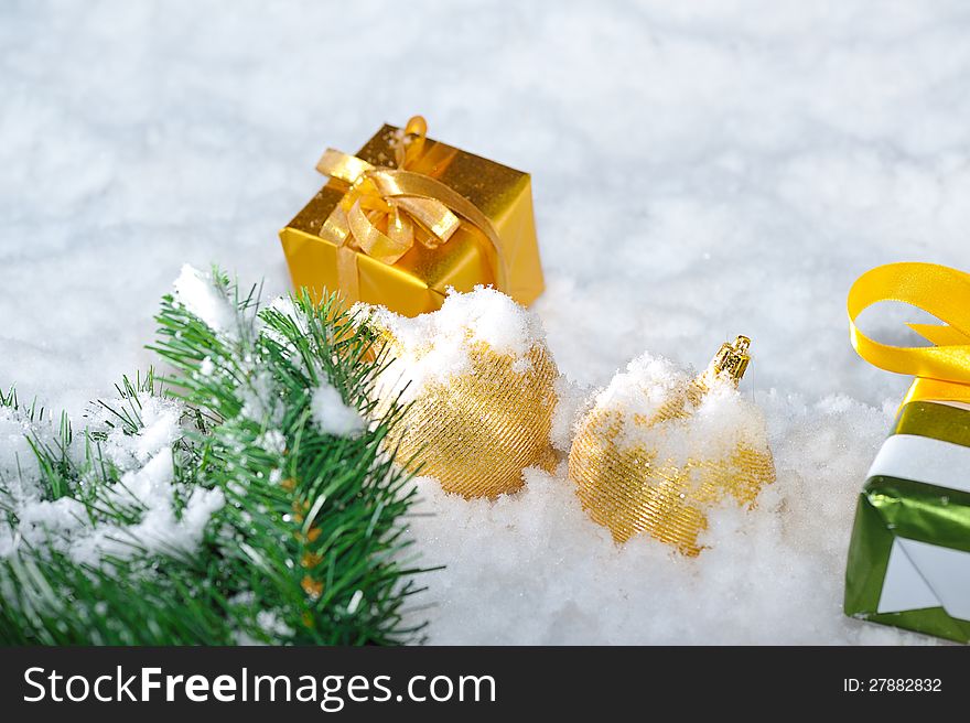Gold  Christmas decoration  on snow. Gold  Christmas decoration  on snow