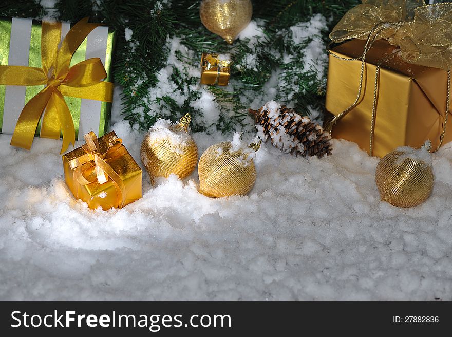 Golden Christmas decoration on snow. Golden Christmas decoration on snow