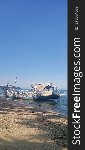 Broken fishing boat, left to be destroyed by nature