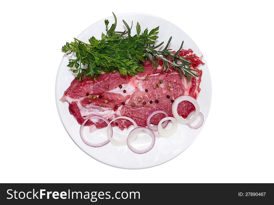 Raw steak with fresh onions and spices