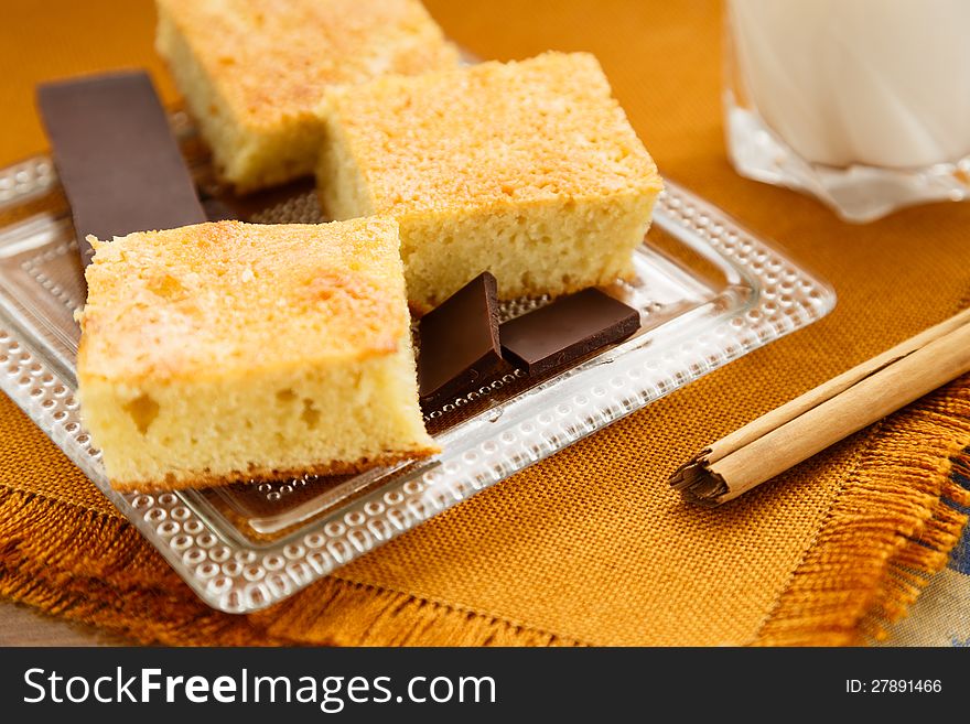 Portions of homemade cake with chocolate and glass of milk for breakfast or snack. Portions of homemade cake with chocolate and glass of milk for breakfast or snack