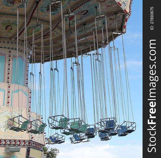 The Hanging Swing Seats of a Fun Fair Ride.