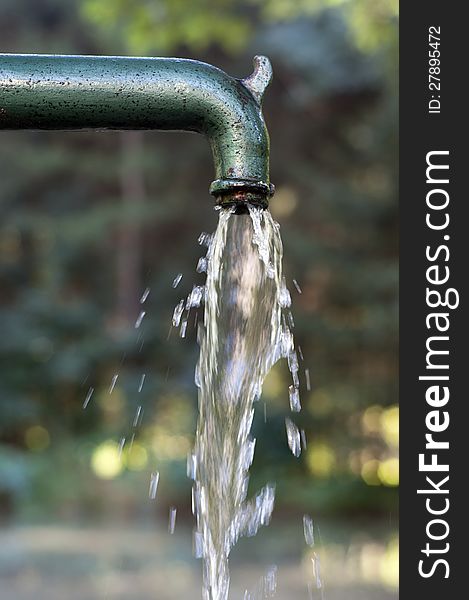 Drinking water running  from an old  water fountain.