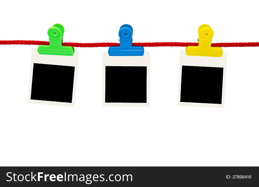 Blank photo frames Hanging by plastic peg on white background