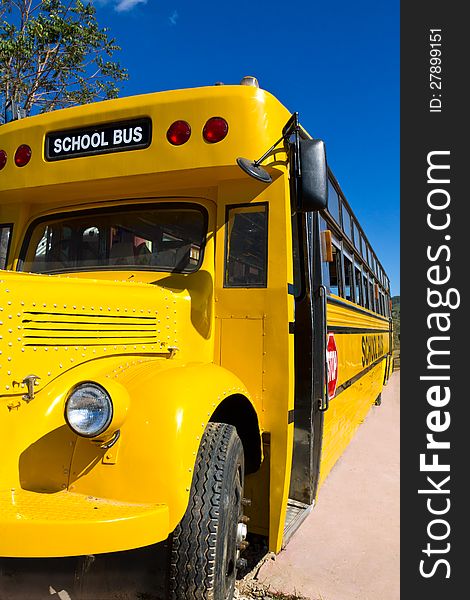 Front of Yellow School Bus with Blue Sky