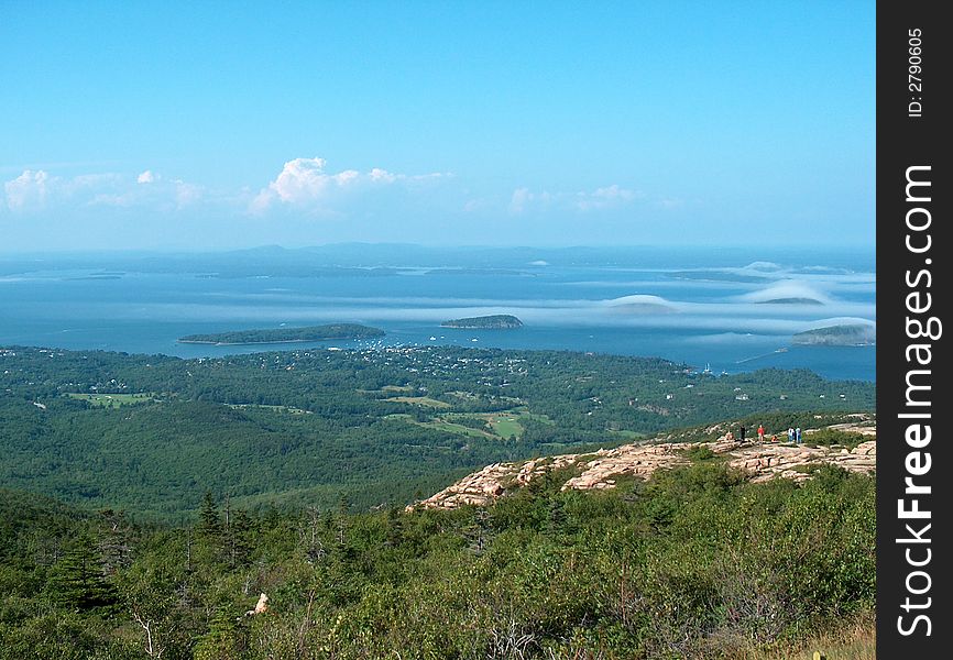 Shows view from the top of Cadillac Mountain of the distant fog shrouded islands. Shows view from the top of Cadillac Mountain of the distant fog shrouded islands