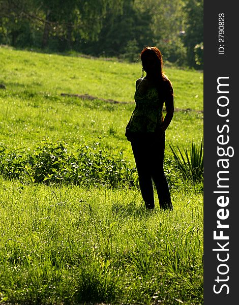 A beautiful girl walking in the park. A beautiful girl walking in the park