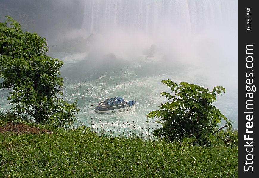 A loaded Tour Boat drivs into the falls At Niagra Falls Ontario Canada. A loaded Tour Boat drivs into the falls At Niagra Falls Ontario Canada