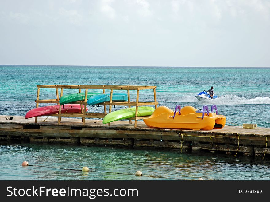 Colorful kayaks hanging to dry