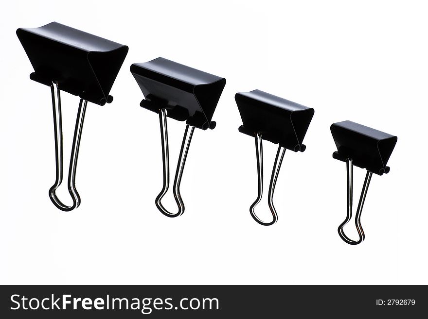 Black Metal Paper Clips On A White Background, Office Object, Stationery