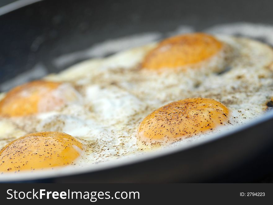 Cooked fried eggs and pepper