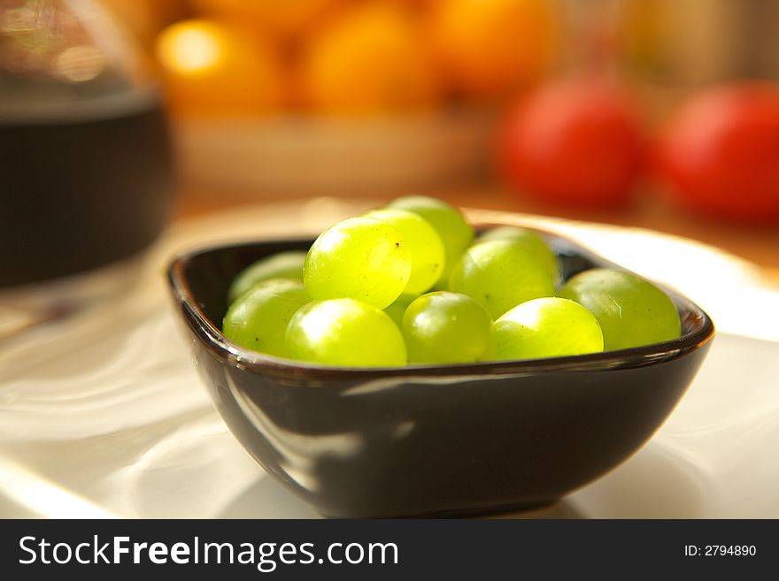Fresh green grapes fruits in porcelain
