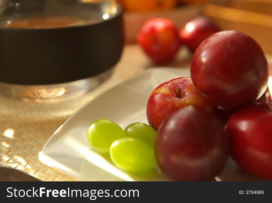 Fresh fruits, grapes, plums and oranges