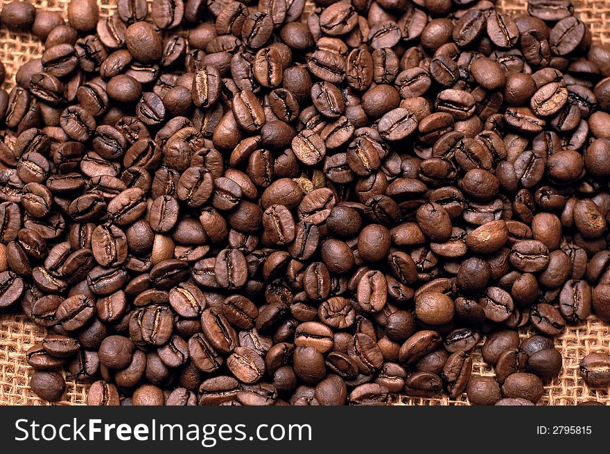 Roasted coffee beans on a bag. horizontal photo
