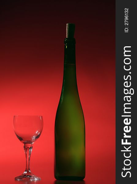 Bottle of white wine on red background. Bottle of white wine on red background