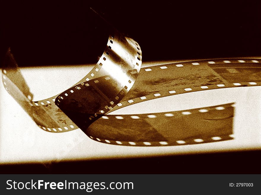 Black and white negative strip on a white table. Black and white negative strip on a white table